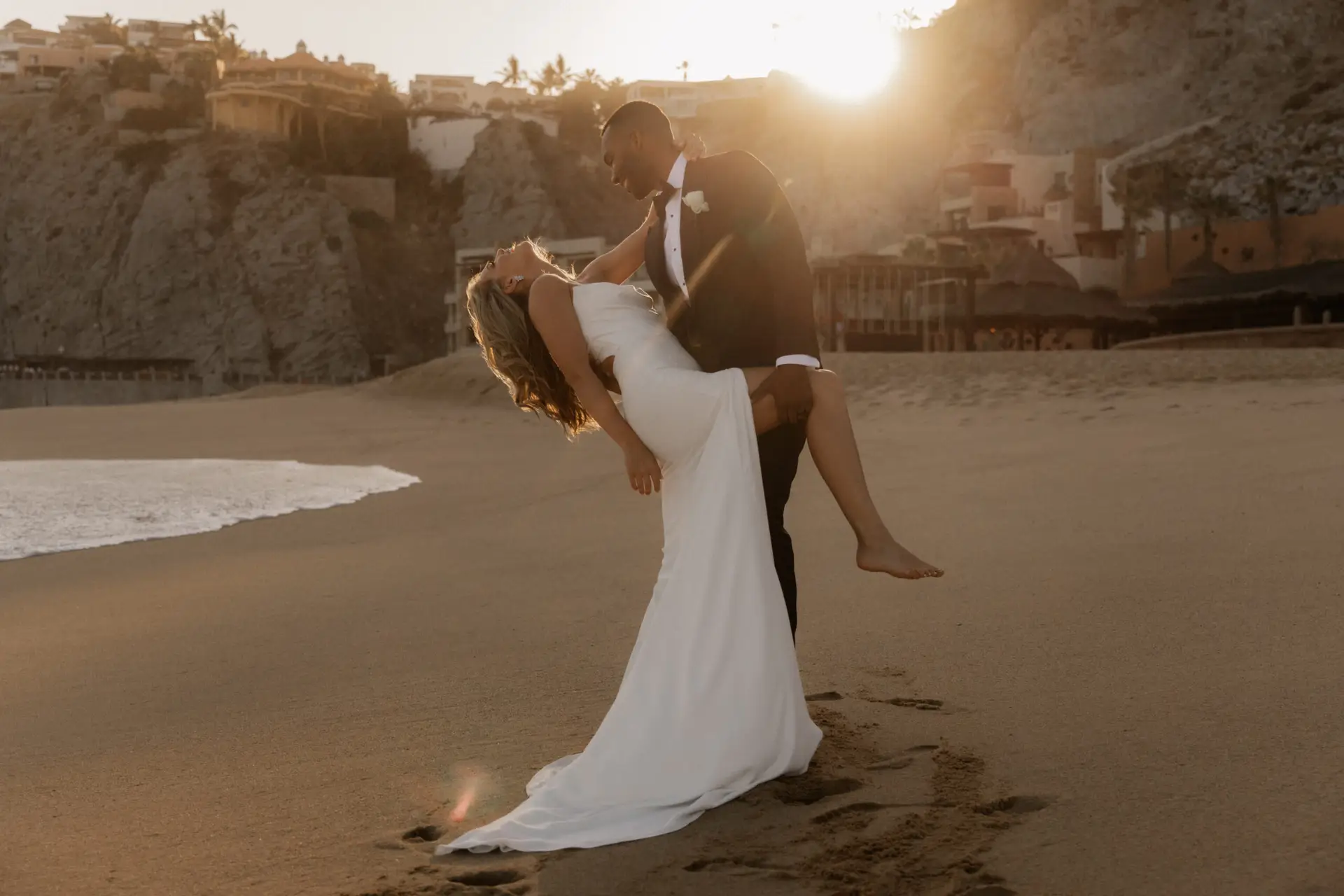 Couple embracing on a beach sunset. photo taken by Ximena Zermeño Global Luxury Destination Wedding Photographer, ximenazermeno.com