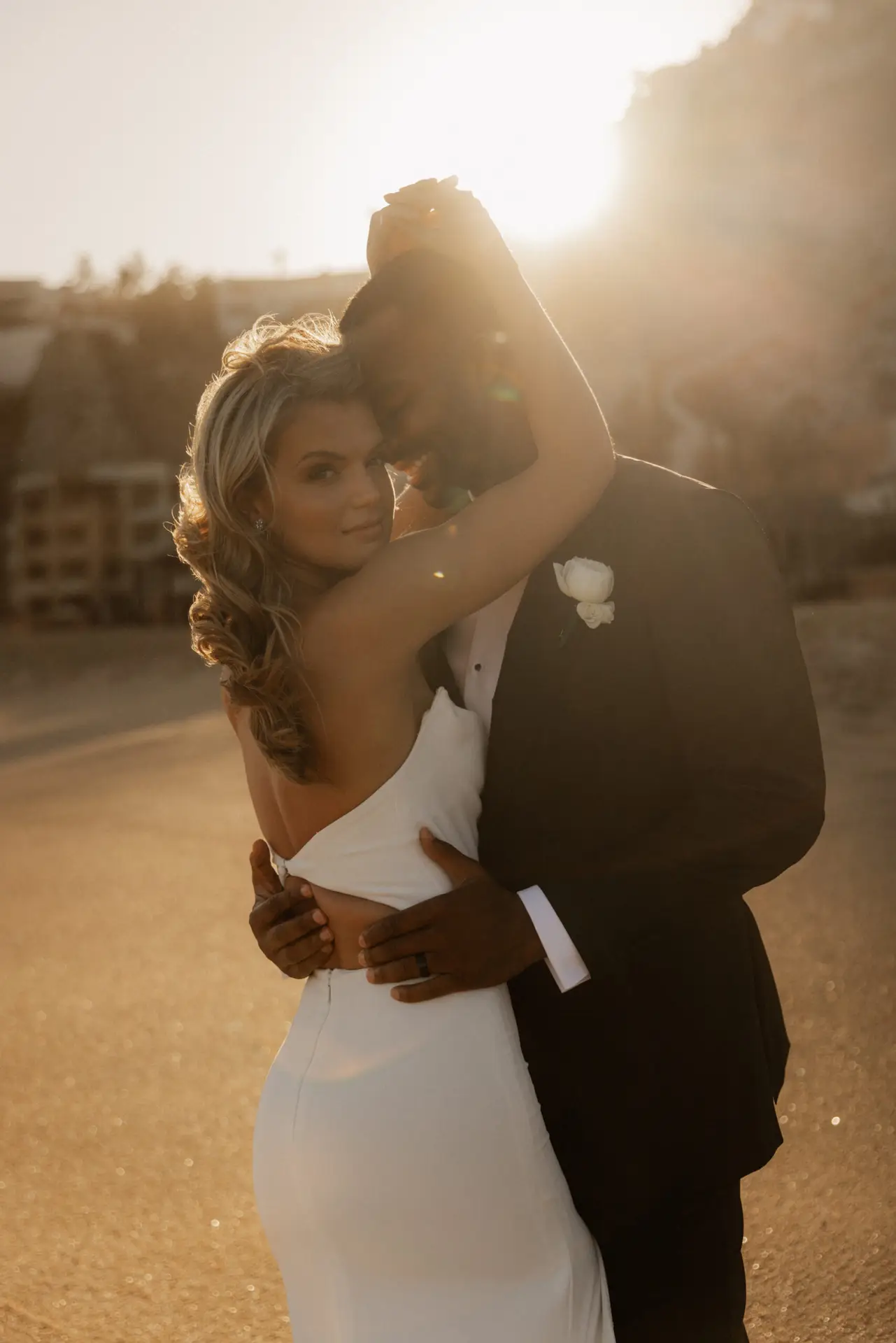 Couple embracing during golden hour. photo taken by Ximena Zermeño Global Luxury Destination Wedding Photographer, ximenazermeno.com