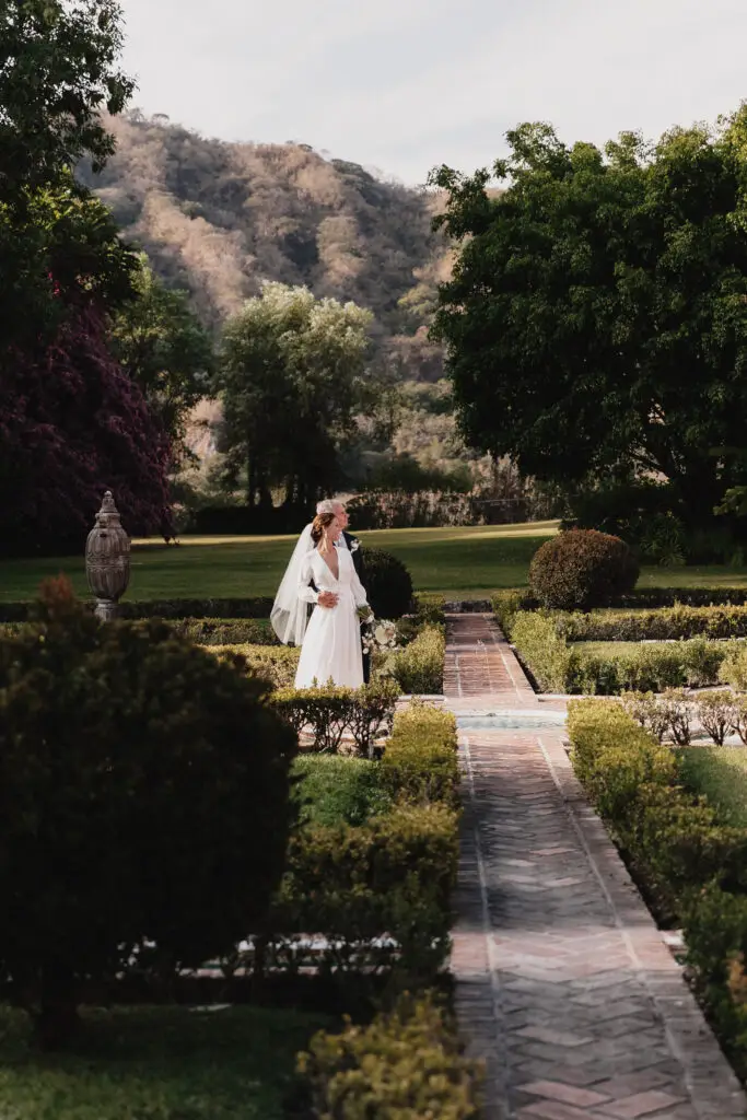 Bride in a lush garden setting. photo taken by Ximena Zermeño Global Luxury Destination Wedding Photographer, ximenazermeno.com