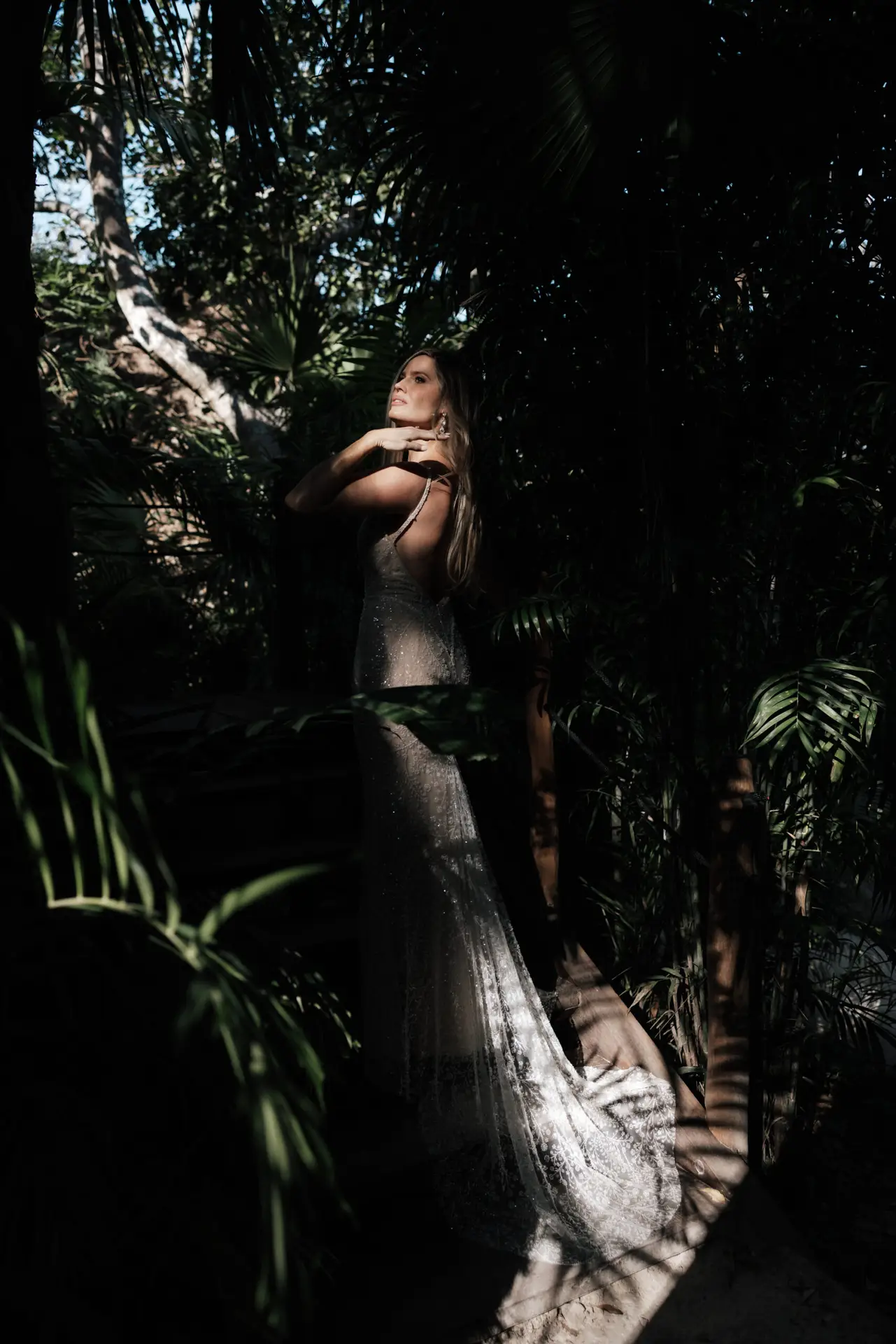 Bride’s dress catching low tropical light photo taken by Ximena Zermeño Global Luxury Destination Wedding Photographer, ximenazermeno.com