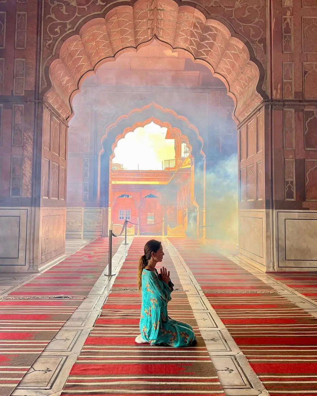 Ximena at a temple meditating photo taken by Ximena Zermeño Global Luxury Destination Wedding Photographer, ximenazermeno.com