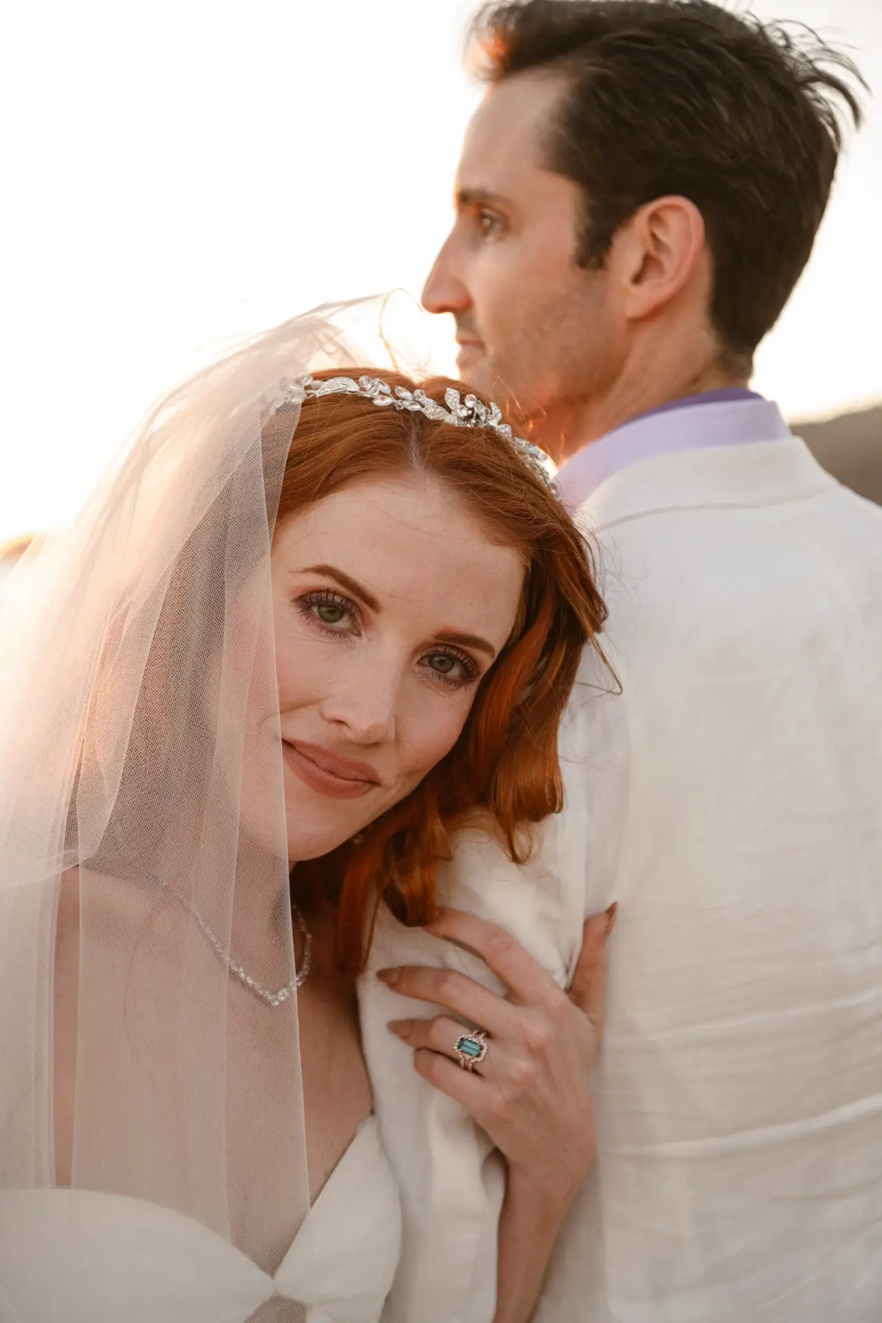 Couple embracing during sunset wedding. photo taken by Ximena Zermeño Global Luxury Destination Wedding Photographer, ximenazermeno.com