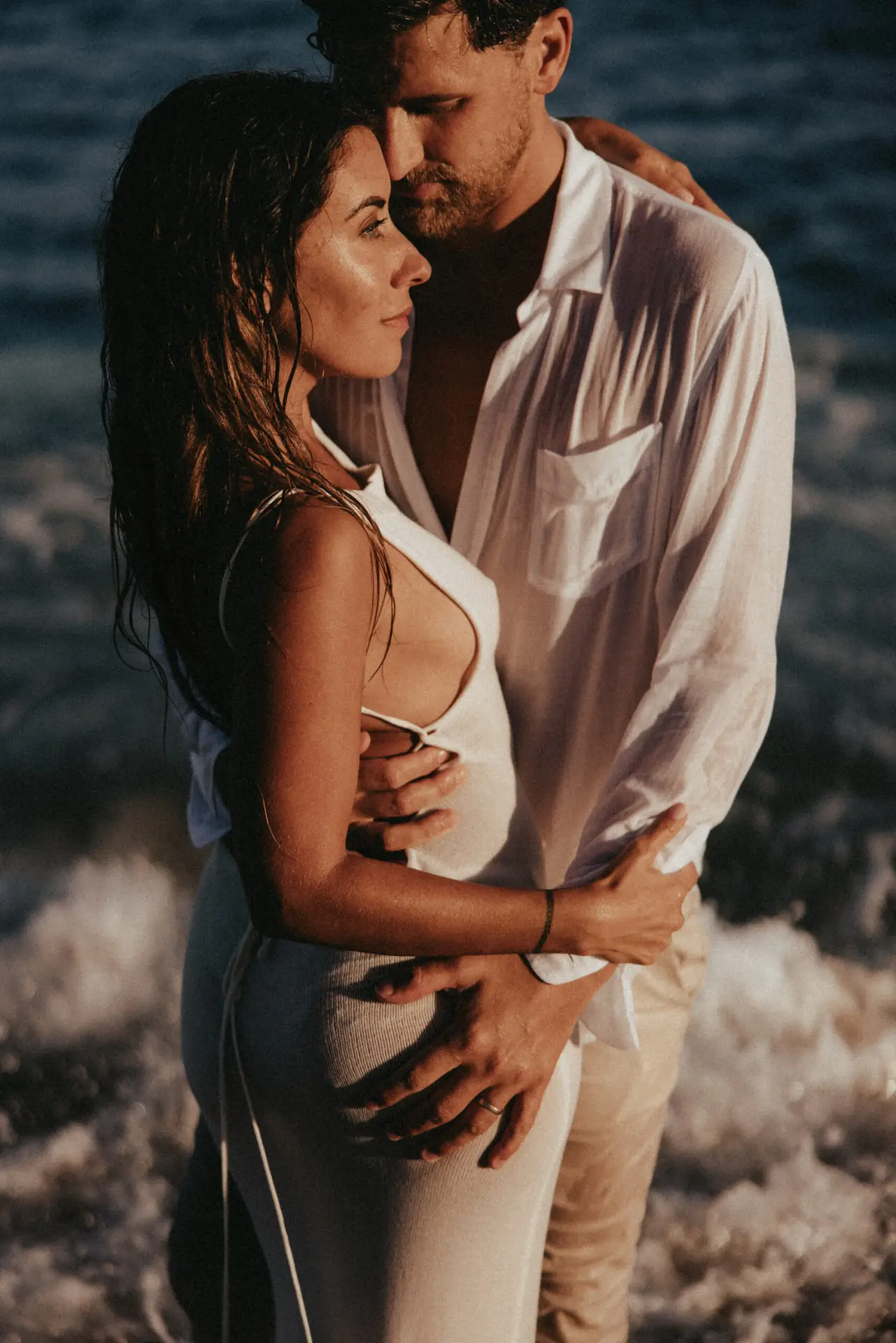 Couple sharing a moment at the beach photo taken by Ximena Zermeño Global Luxury Destination Wedding Photographer, ximenazermeno.com