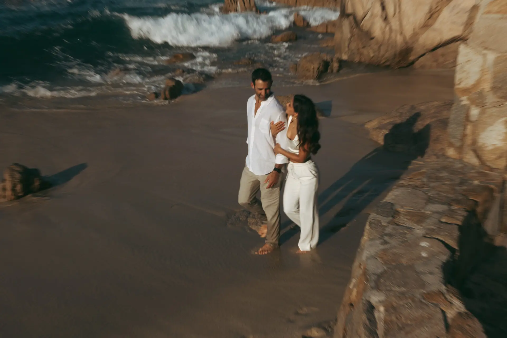 Couple walking at the beach photo taken by Ximena Zermeño Global Luxury Destination Wedding Photographer, ximenazermeno.com
