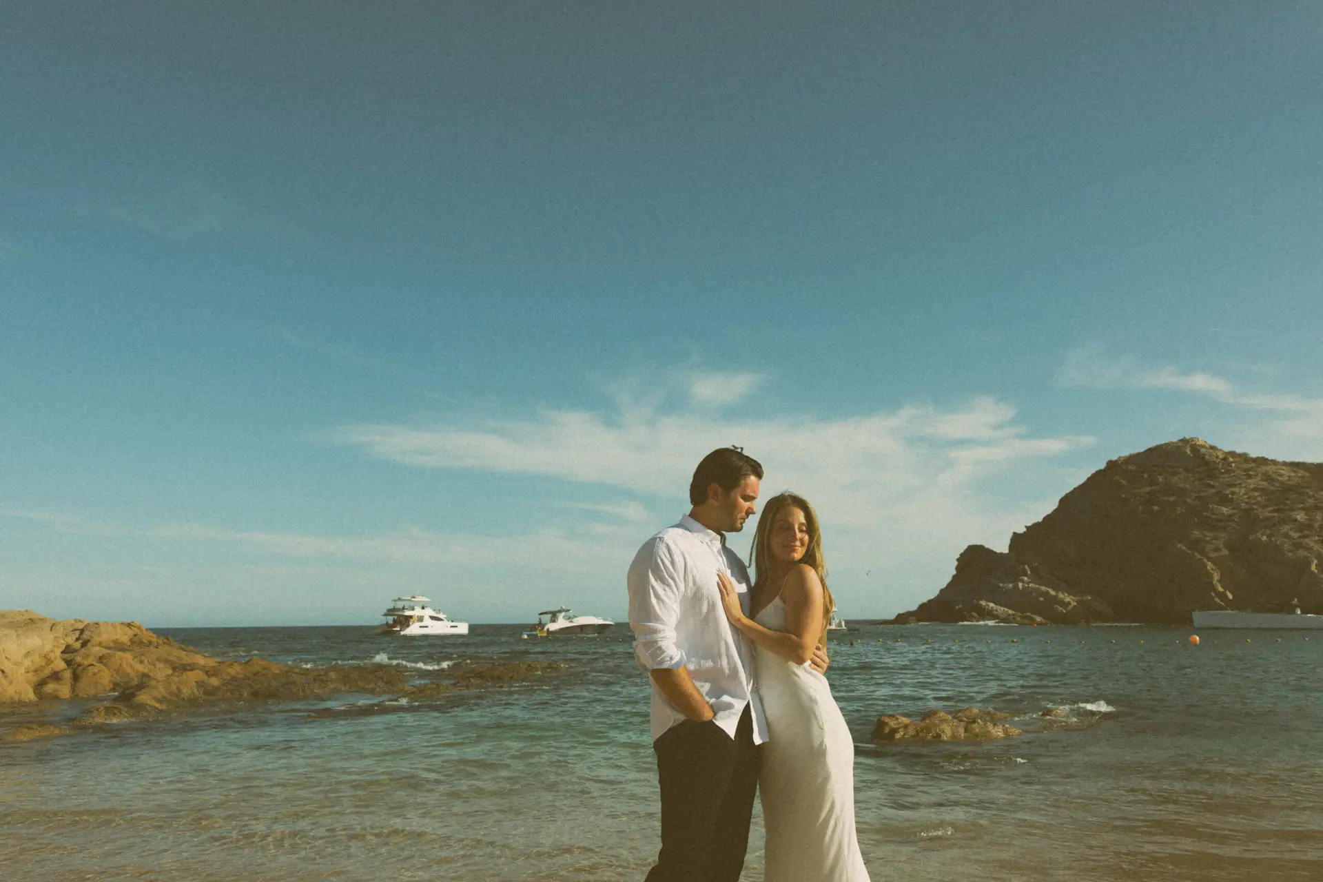 Sharing love at the beach photo taken by Ximena Zermeño Global Luxury Destination Wedding Photographer, ximenazermeno.com