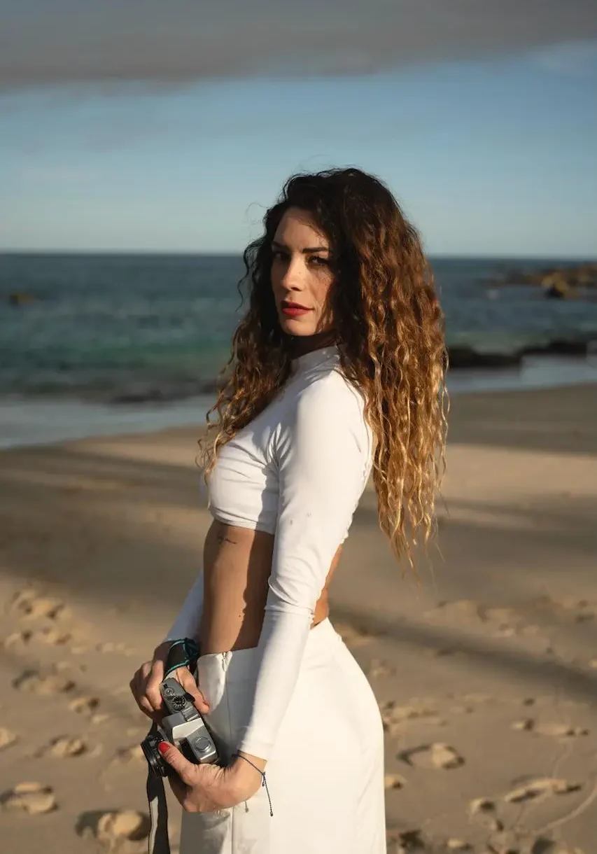 Ximena with a camara at the beach photo taken by Ximena Zermeño Global Luxury Destination Wedding Photographer, ximenazermeno.com