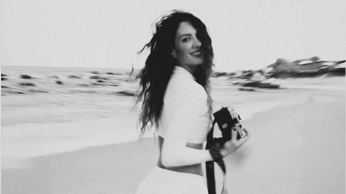 Ximena zermeño with a camara at the beach Photo taken by Ximena Zermeño Global Luxury Destination Wedding Photographer, ximenazermeno.com